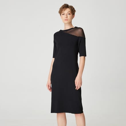 Minimalistische jerseyjurk met asymmetrisch snijden