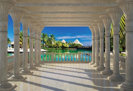 Fotobehang Tropical View Through Pillars | XL - 208cm x 146cm | 130g/m2 Vlies