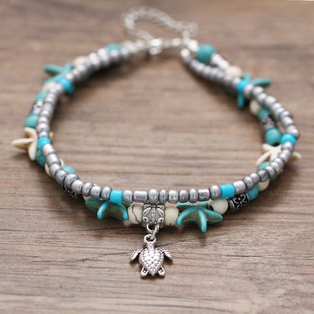 armband met veer goudkleurig