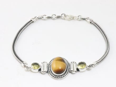 Bewerkte zilveren armband met tijgeroog en citrien