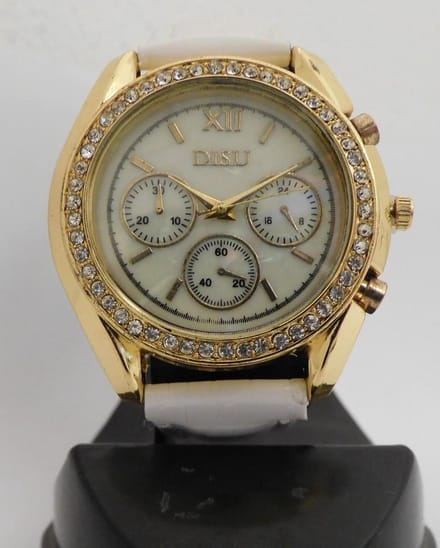Goudkleurige horloge met steentjes en witte band