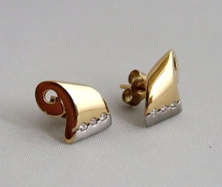 Christian bicolor oorbellen met diamanten