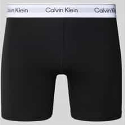 Broek met label in band