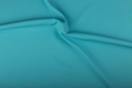Texture/polyester stof - Licht waterblauw - 25 meter