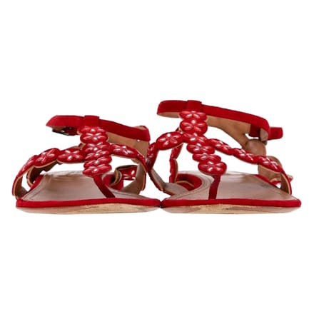 Alaïa Flower Lasercut Enkelband Flate Sandalen in Rood Suède
