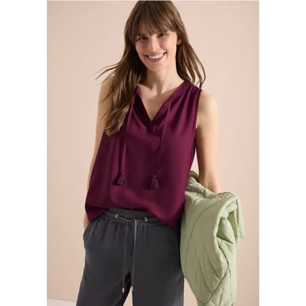 Blousetop met gespleten hals en linten