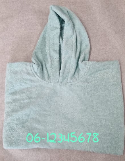 Poncho met naam en/of Telefoonnummer geborduurd