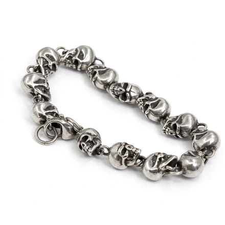 Zilverkleurige heren schakel armband met schedel schakels