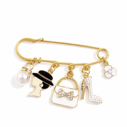 Goudkleurige broche - sierspeld met bedels (o.a. handtas)
