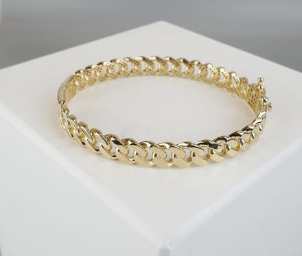 Christian Dames schakelarmband - Goud