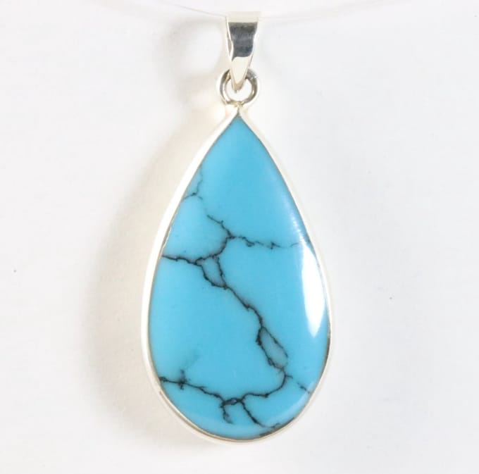 Druppelvormige zilveren hanger met blauwe turkoois