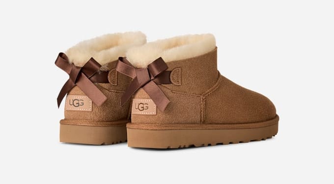 UGG® Ultra Mini Bailey Bow Boot in Brown, Size 8, Polyester/Leather