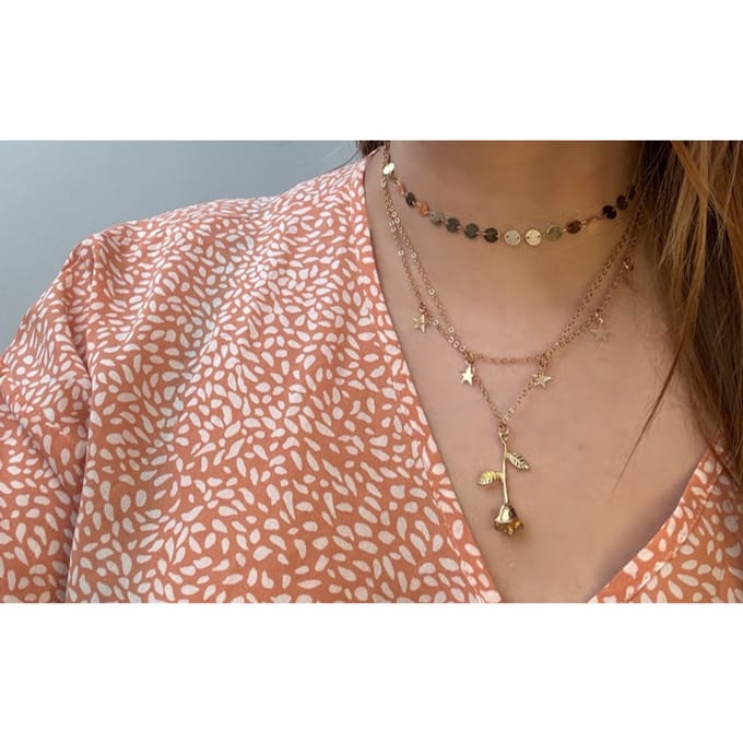 Laagjes ketting met een roos & sterretjes | goud gekleurd