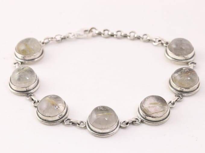 Bewerkte zilveren armband met gouden rutielkwarts