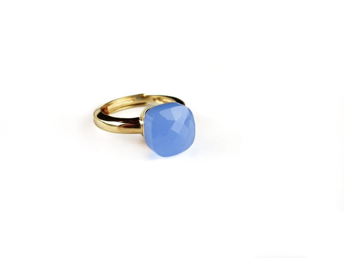 Ring in zilver geelgoud verguld model pomellato blauwe steen