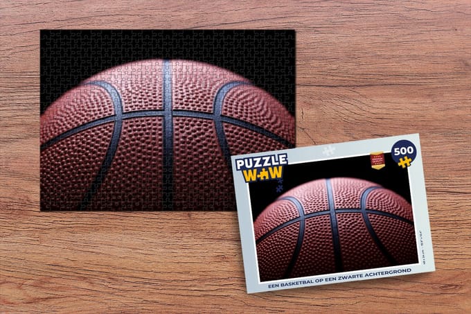 Puzzel Een Basketbal op een zwarte achtergrond - Legpuzzel - Puzzel 500 stukjes