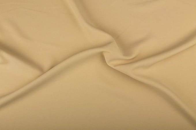 Texture/Polyester stof - Licht beige - 25 meter rol