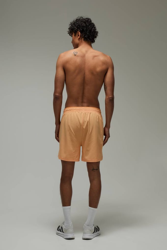 Common Pace Hardloop Geperforeerde 5 Inch Short | Coral | Size Small