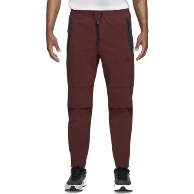 Nike tech fleece woven pants in de kleur rood.