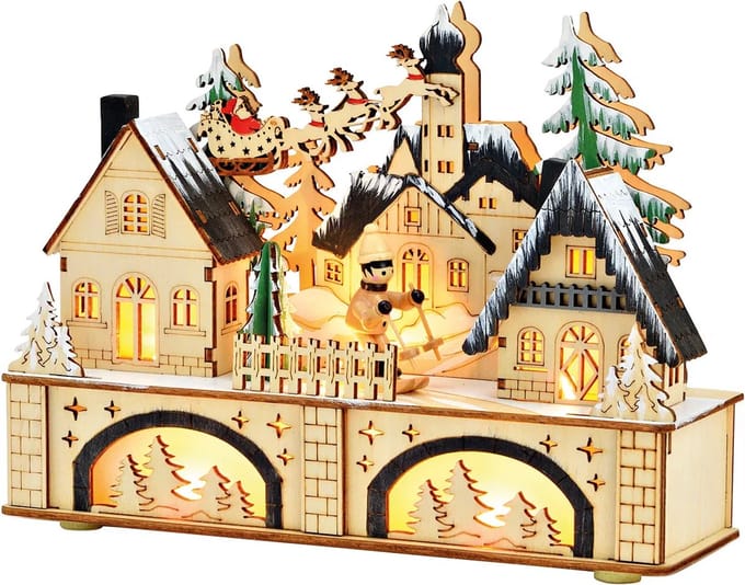 Kerst houtsnijwerk kerstdorp met vliegende arreslee