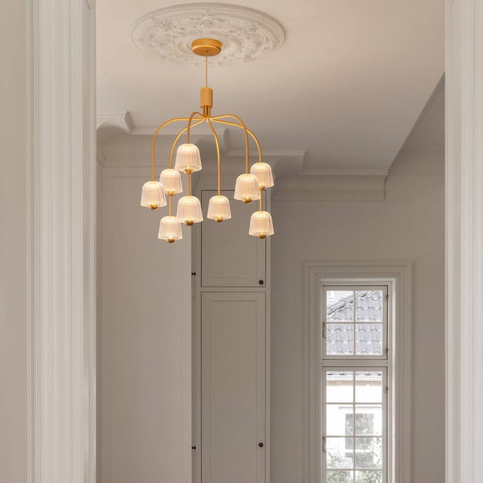 Nuura LED kroonluchter Asteea 9, Ø 66 cm, messingkleurig/helder