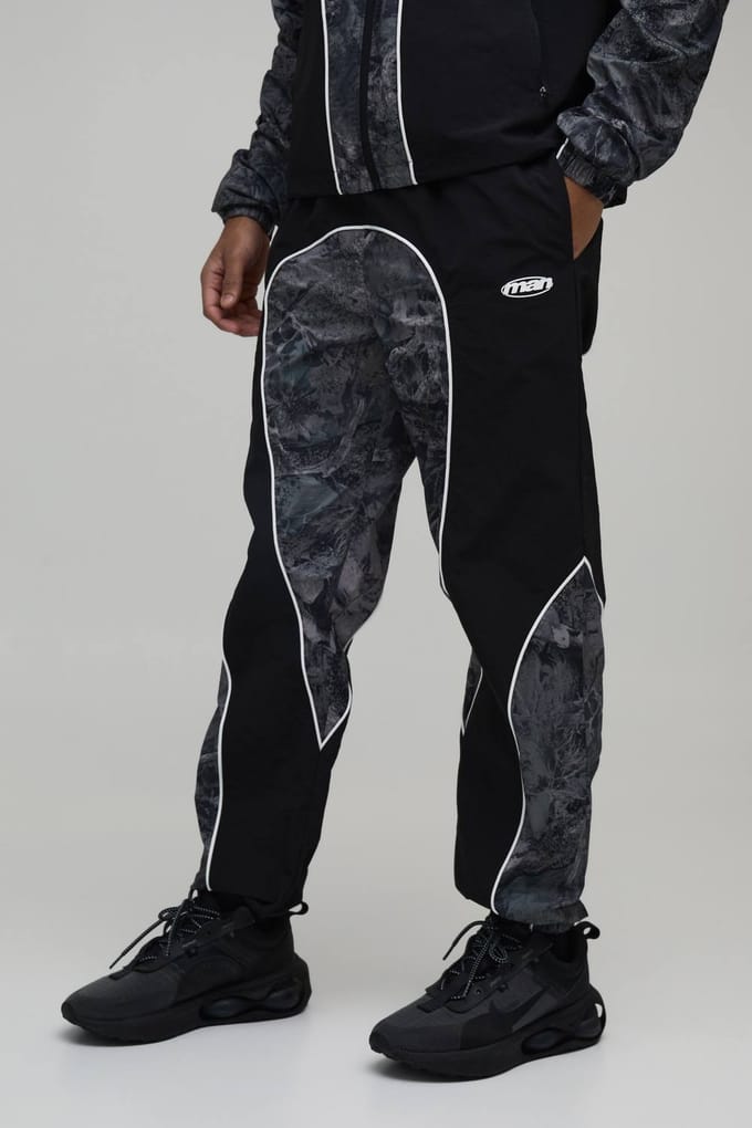 Relaxed Fit Nylon Camo Colour Block Piping Track Pants | Size Medium