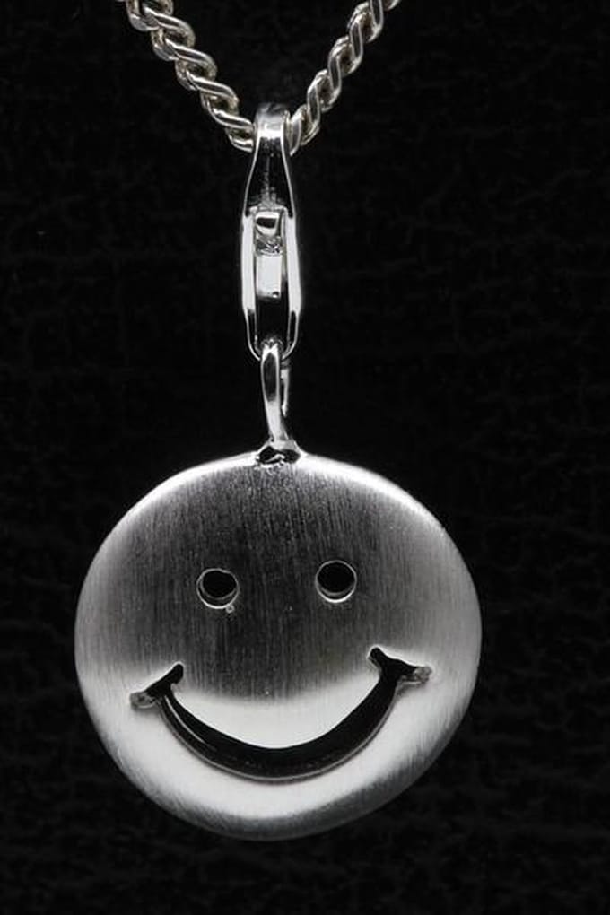 Zilveren Smiley mat hanger én bedel
