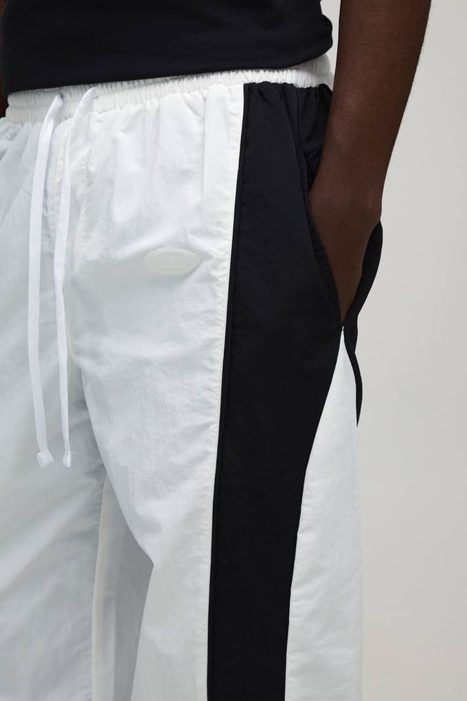 Relaxed Fit Curve Panel and Binding Toggle Hem Nylon Track Pants | White | Size XS
