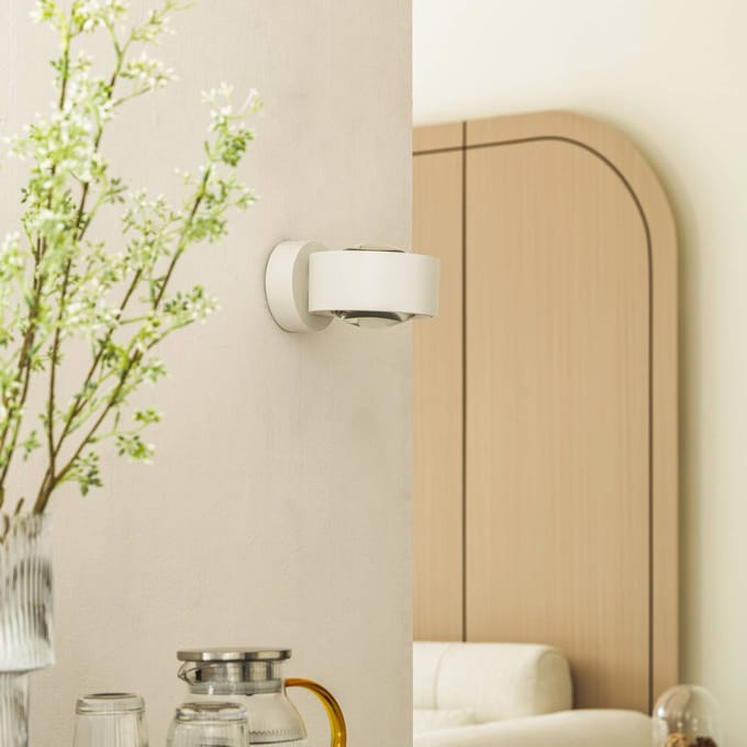 Arcchio LED wandlamp Rotari, lens, omhoog/omlaag, wit, metaal