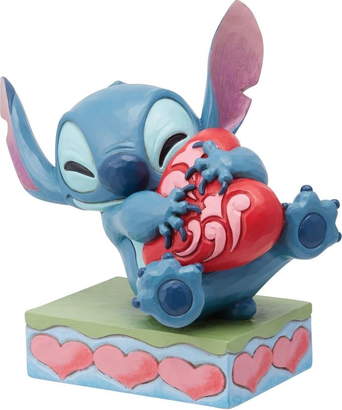Disney Traditions Stitch Hugging a Heart Figurine