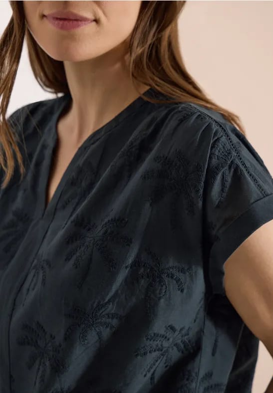 Blouse met hangende schouder en borduursel