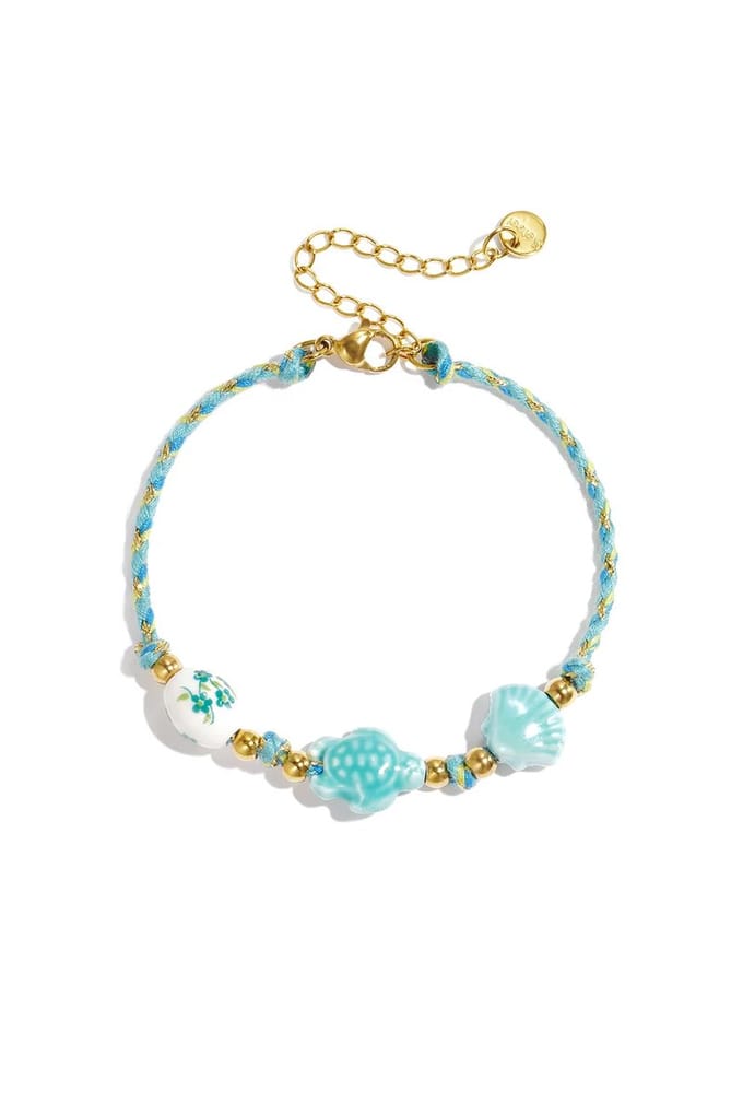 Armband met schildpad en schelp kralen en touwmotief groen