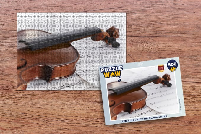 Puzzel Een viool ligt op bladmuziek - Legpuzzel - Puzzel 500 stukjes
