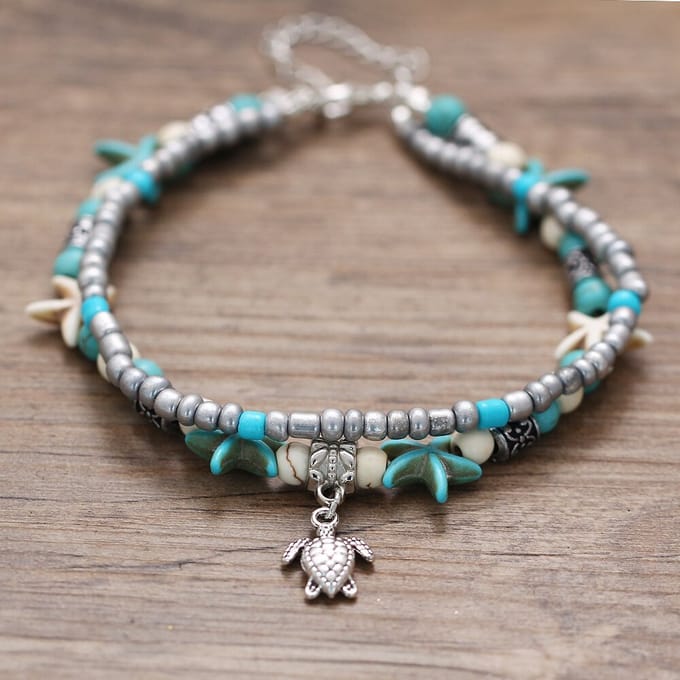 armband met veer goudkleurig