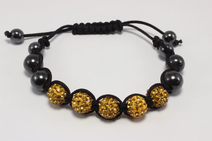 Armband met onyx en glitterparels