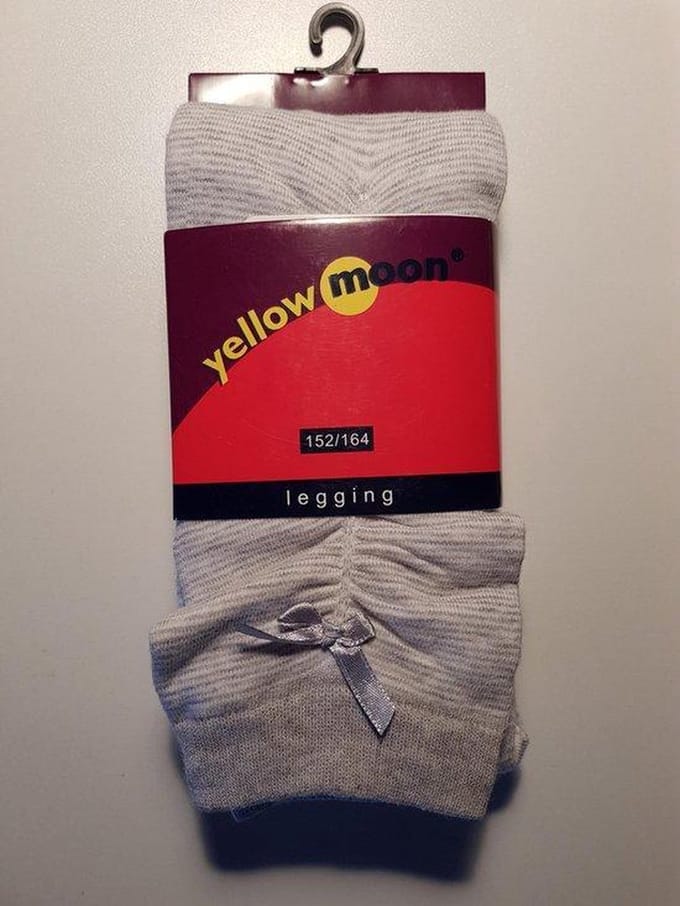 Katoenen legging, wit met grijs streepje en strikje maat 122-128