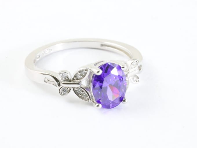 Hoogglans zilveren ring met blauwe saffier en witte topaas - maat 20