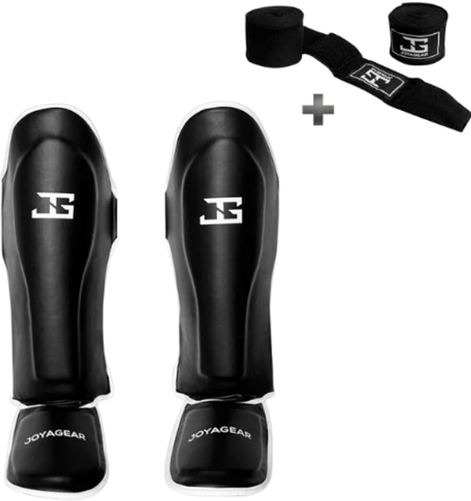 Joya SKINTEX Scheenbeschermers – Kickboksen/Muay Thai/MMA – Zwart/Wit – Maat S – Gegoten model, extra dikke padding – Inclusief Bandage