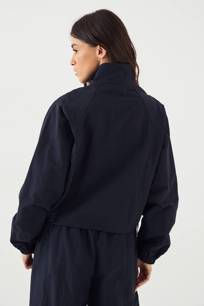 Dames DSGN Studio Funnel Neck Trainingsjack | Marineblauw | Maat: Medium