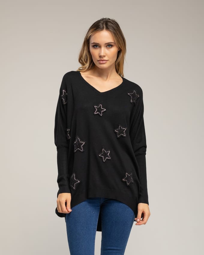 Oversized lange gebreide trui met opgetikte stoffen sterren met strass.