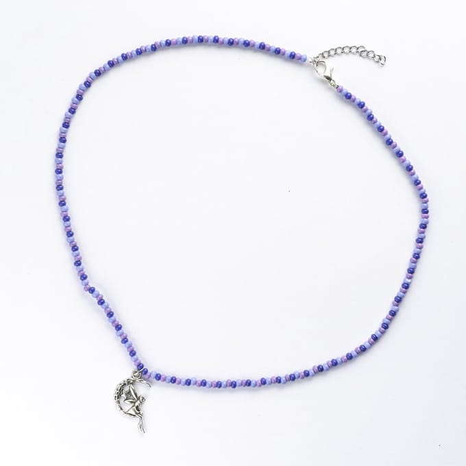 Ketting in paarstinten met elfje hanger