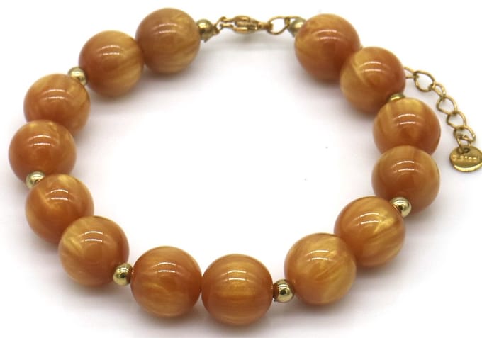 Armband - RVS en acryl kralen - bruin - dames