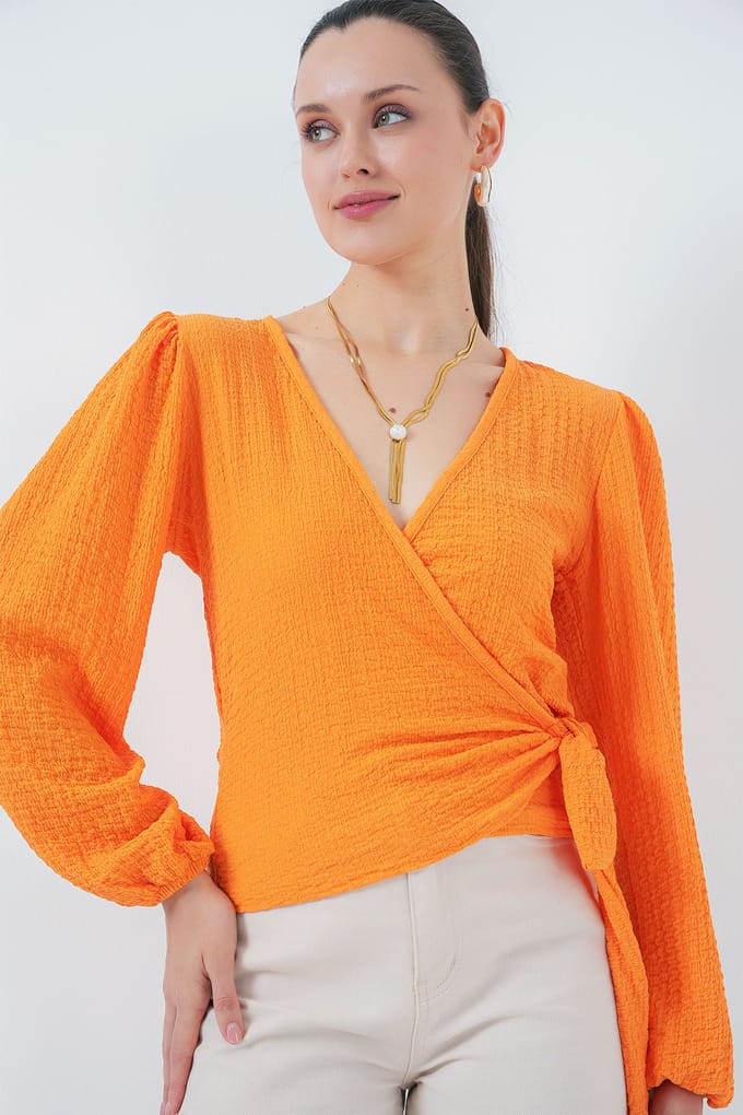 Textuur V-hals Blouse met Pompom en Striksluiting