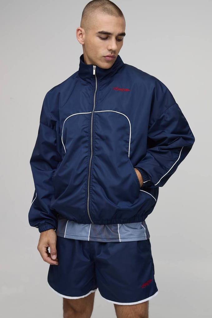 Boxy Shell Trainingspak Met Geborduurd Naaddetail, Col En Dubbele Rits Kort Model | Navy | Size Medium