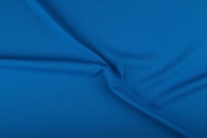 Texture/polyester stof - Waterblauw - 25 meter