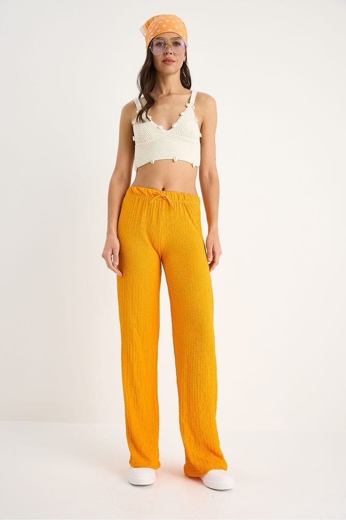 Textuur brede pijpen broek met strik