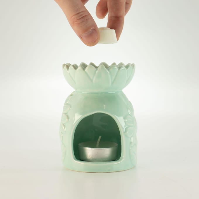 Keramische zonnebloemoliebrander - pastelgroen