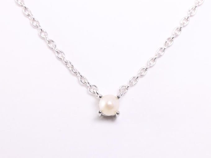 Fijne zilveren anker ketting met witte zoetwater parel
