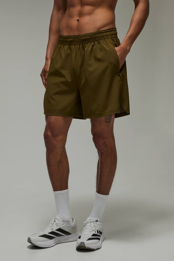 Common Pace Hardloop Geperforeerde 5 Inch Short | Olive | Size Medium