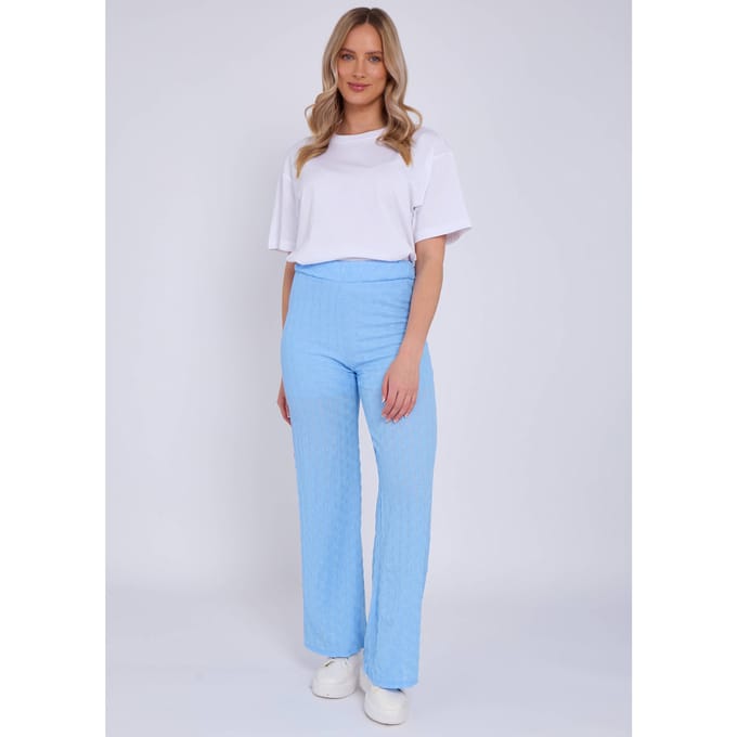 Hemelsblauwe broek met elastische taille en uitlopende pijpen